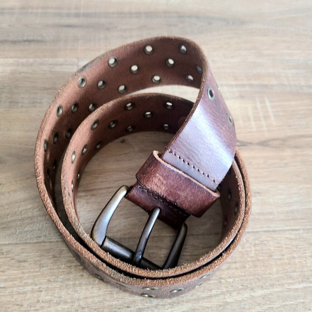 Fossil brown leather belt with metal details.